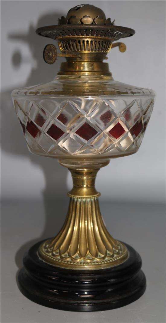 An Edwardian glass and brass oil lamp